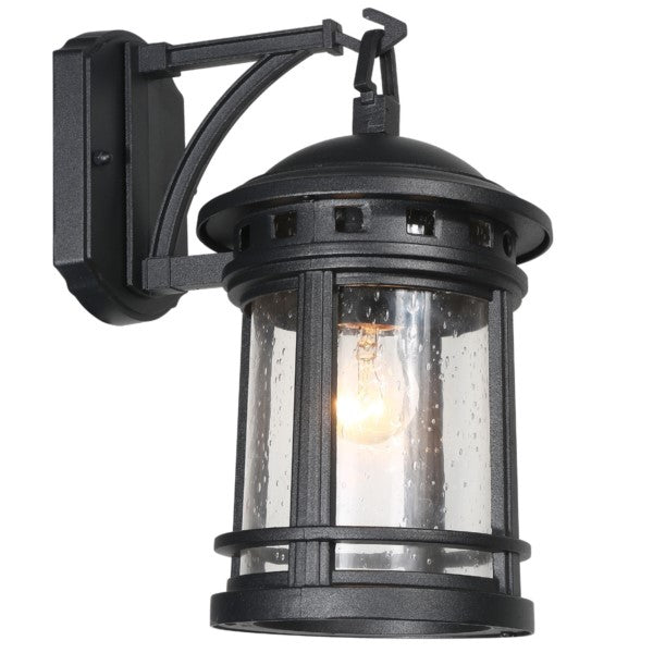 Eingeschaltete Außenwandleuchte mit Tropfenglas, erzeugt warmes Licht und dekorative Wirkung.